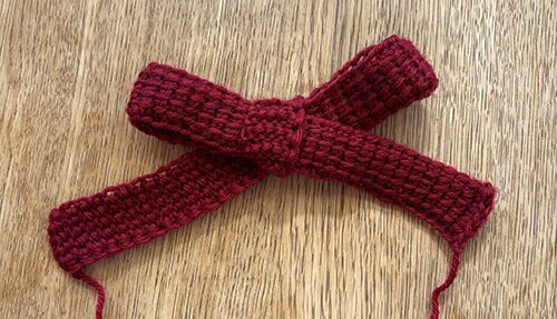 ６目で編んだアフガン編みを蝶々結び